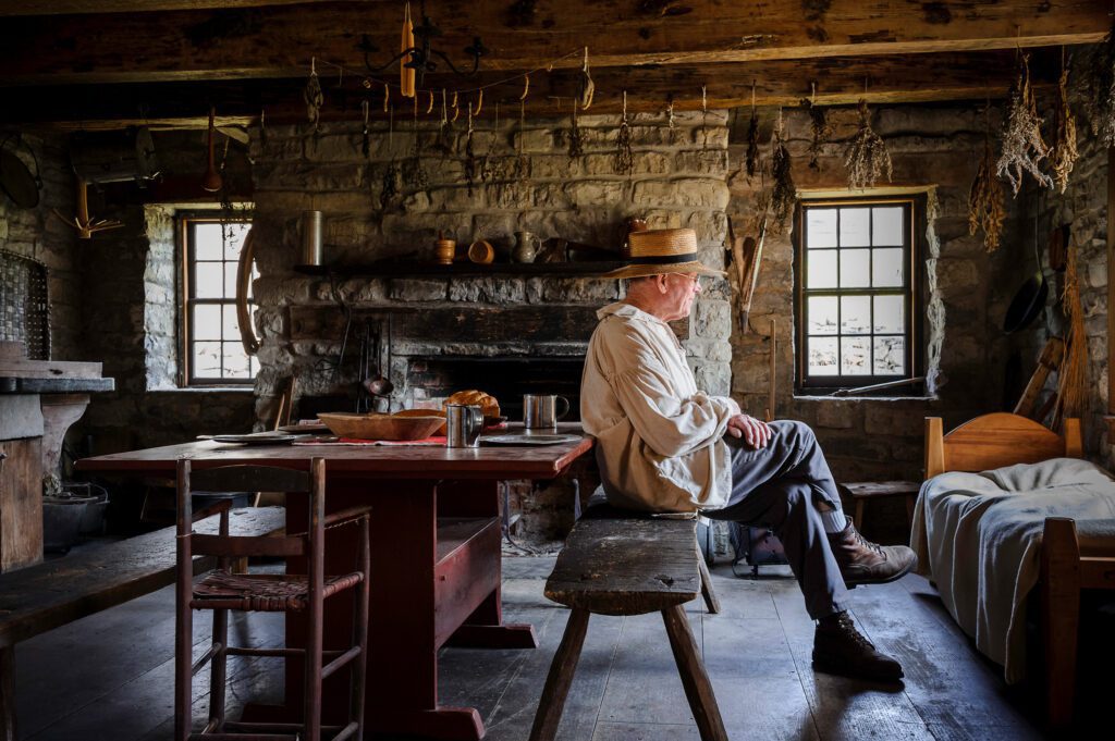 a man in an old cabin